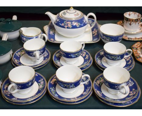 A Wedgwood Blue Siam Tea Set Comprising Six Trios, Teapot, Bread and Butter Plate, Cream and Sugar etc 