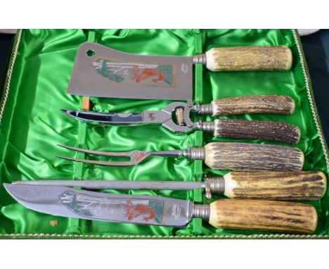 A Cased German Cutlery Set with Stag Decoration and Bone Handles 