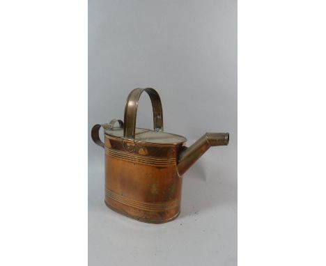 An Army and Navy Copper Watering Can, 27cm High 