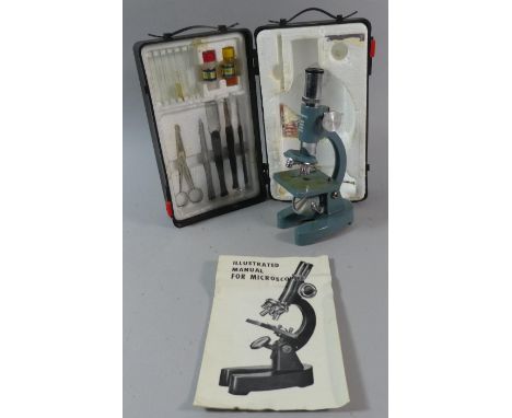 A Cased Child's Microscope with Manual 