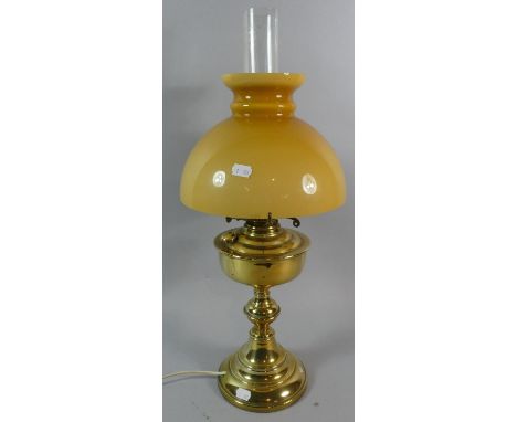 A Late 19th Century Brass Oil Lamp, Now Converted to Electricity, Amber Glass Shade and Plain Glass Chimney 