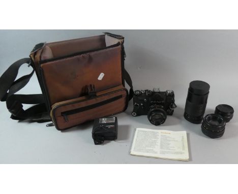 A Camera Bag Containing Zenit 35mm Russian Camera, Instruction Manual, Three Extra Lenses etc 
