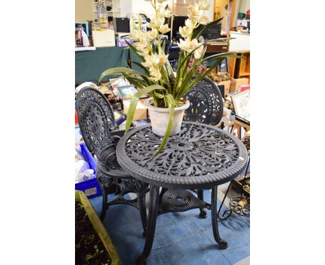 A Plastic Patio or Garden Table and Chair Set Together with an Artificial Plant 