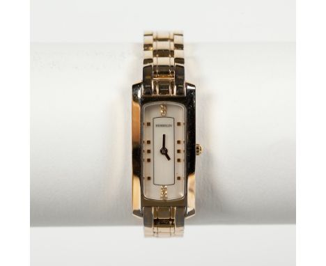 LADY'S MICHEL HERBELIN WRIST WATCH
the rectangular dial with dot numerals, in a gold-coloured case and on a gold-coloured bra