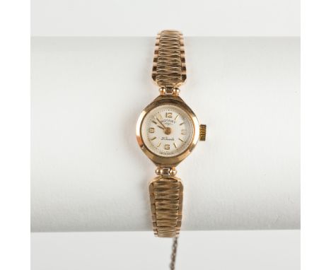 LADY'S NINE CARAT GOLD ROTARY COCKTAIL WATCH
the round dial with Arabic and baton numerals, on a bracelet strap