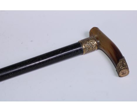 A 19th century gilt metal mounted walking stick, L-shaped horn handle, ebonised cane 