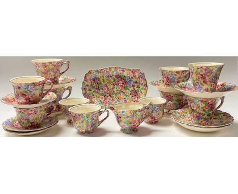 A set of James Kent Fenton Apple Blossom pattern chintz tea cups and saucers, assorted, a milk jug and sugar bowl on stand 