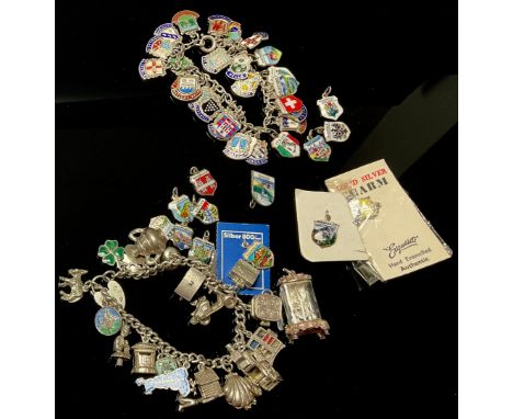 A sterling silver curb link charm bracelet, including sedan chair, mantel clock, caravan, Gladstone bag, scallop shell, weath