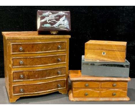 A walnut and mahogany veneer collector's/jewellery cabinet, as a miniature serpentine chest of drawers, bracket feet, 27cm hi