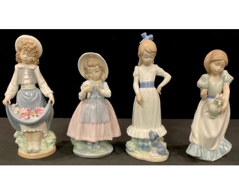 A Nao figure, Girl with Puppy, three others similar, girls with flowers (4) 