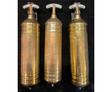 A brass Pyrene hand pump fire extinguisher, on wall bracket; others (3) 