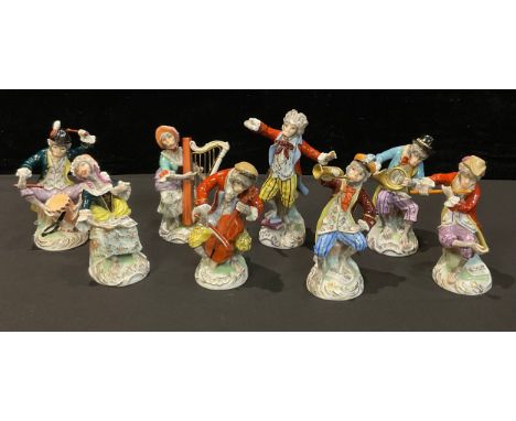 A set of eight Dresden monkey band figures, conductor, drummer, singer, flautist, French horn, viola, trumpet, harpist, appro