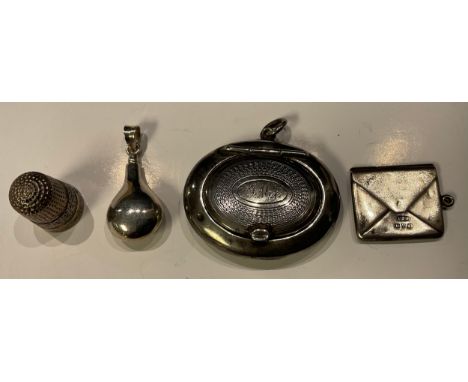 A silver fob stamp case, as an envelope, Chester 1915; a scent flask; a Charles Horner silver thimble, Chester 1915; a compac