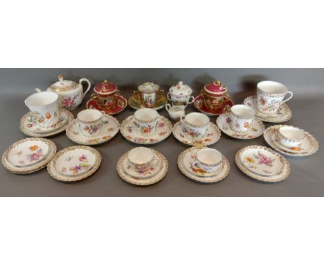 A Dresden porcelain part tea service comprising teapot, cups and saucers and plates, together with a pair of Dresden chocolat
