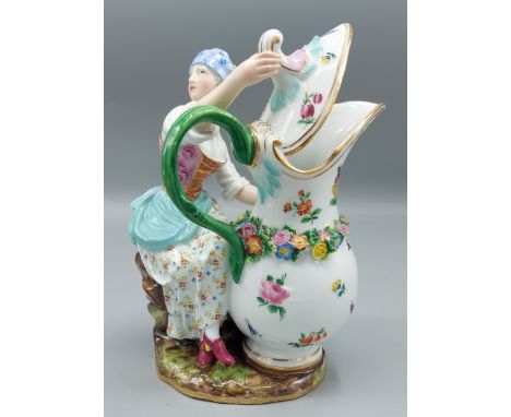 A Meissen porcelain figure in the form of a girl with large pitcher dcorated in polychrome enamels and highlighted with gilt,
