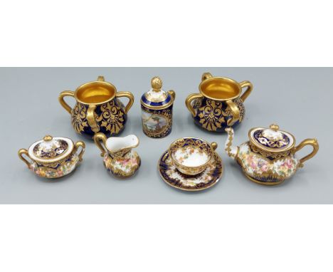 A pair of Coalport porcelain miniature four handled vases together with a similar Coalport covered mug and a Crown Staffordsh