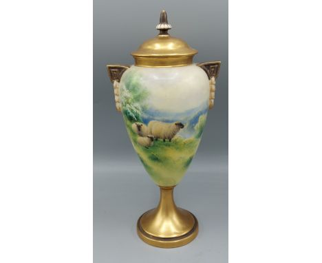 A Royal Worcester porcelain vase decorated by Harry Davis, hand painted with sheep within a landscape and highlighted with gi