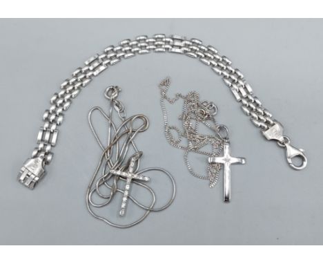 A 925 silver crucifix pendant set with a diamond together with another pendant, two silver chains and a silver gate link brac