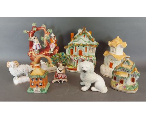 A Staffordshire group together with other Staffordshire models and a Pastel burner 