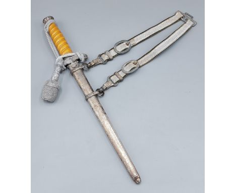 A WWII German Army Officers dress dagger, the blade inscribed E. and F. Horster, Solingen with Pommel and belt clip