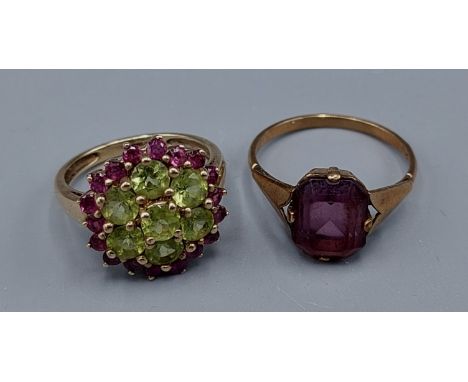 A 9ct gold Peridot and Amethyst set cluster ring together with a 9ct gold Amethyst set ring 