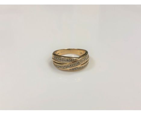 A 9ct gold diamond set cross-over style ring, size J/K