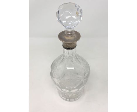 A good quality silver mounted decanter engraved with grapes and vines 