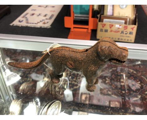 A cast iron dog nut cracker 