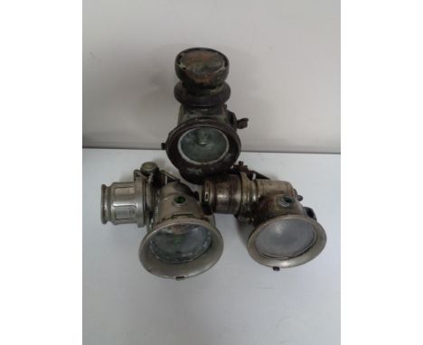 A Lucas Kings Own Carbide lamp together with two others 