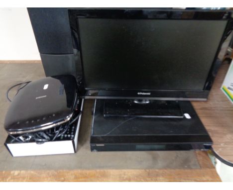 A Polaroid 19 inch LCD TV with remote together with a Samsung pebble DVD player and Humax freesat box 