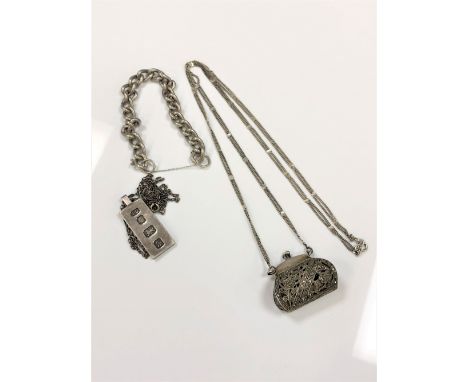 A silver and marcasite handbag necklace, together with an ingot necklace and a bracelet (lacking clasp). (3)