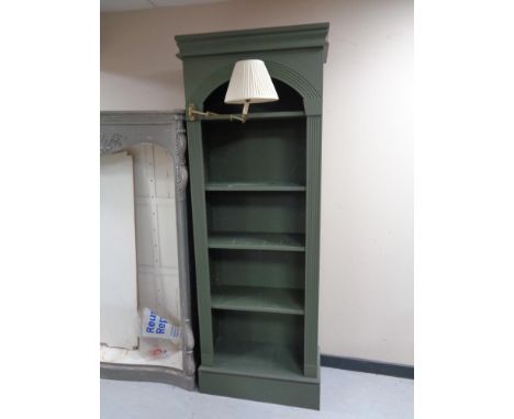 A set of tall painted shelves fitted with reading light 