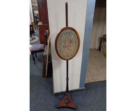 A Victorian tapestry pole screen on stand 