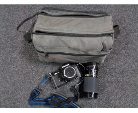 A camera bag containing a Chinon CE-4 camera with lens and accessories 