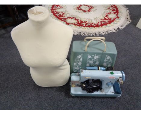 A twentieth century Jones electric sewing machine with female mannequin torso 