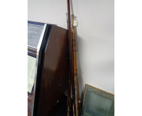 A bundle of vintage fishing rods, cane fishing rods etc 