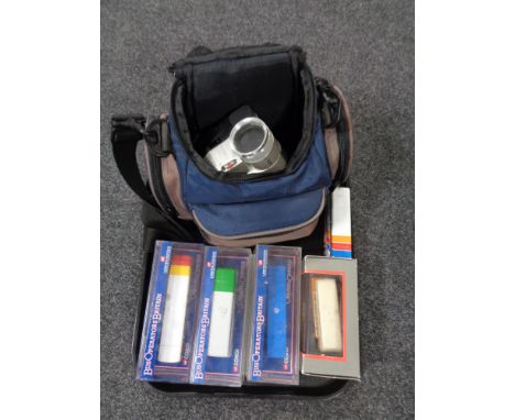 A tray of Hitachi video camera in bag, five Corgi diecast buses 