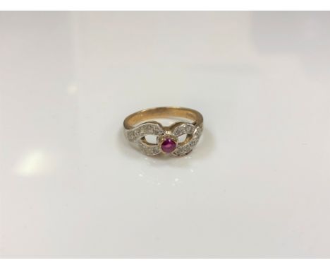 A 9ct gold diamond and ruby ring, size M/N