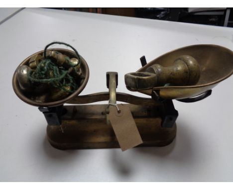 A set of vintage kitchen scales with weights 