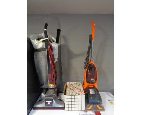 A vintage Kirby II vac with accessories together with a carpet cleaner 
