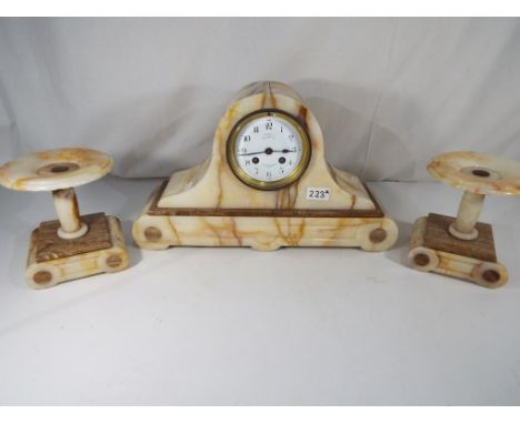 A marble Art Deco style mantel clock with garniture, marked to the dial Henri Godchot,  Paris - Est £40 - £60