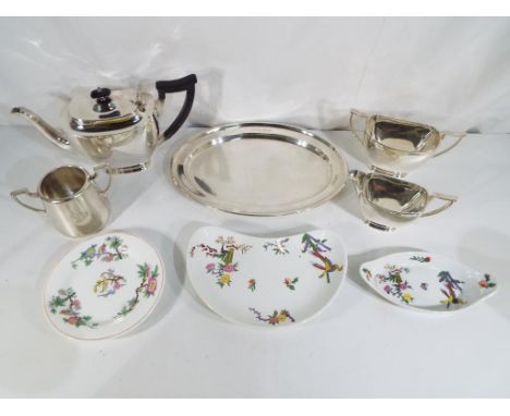 A good lot to include a three piece silver plated tea set comprising a teapot, milk jug and  sugar bowl, also included is a c