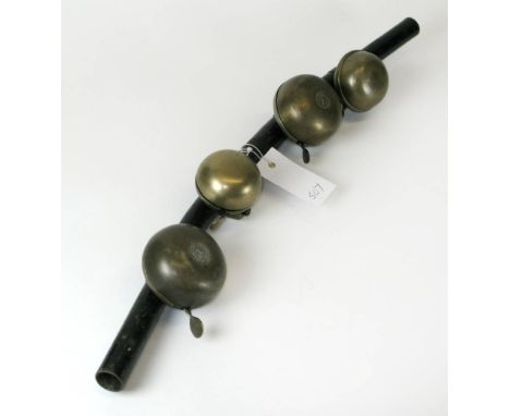 *J. Lucas Ltd., Four Bicycle Bells. Mounted on a pair of motorcycle handlebars,  each in good, usable condition  (1)