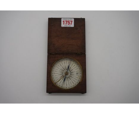 A 19th century mahogany cased pocket compass, 9.5cm wide.&nbsp; 