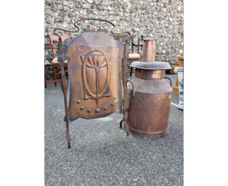 An Art Nouveau copper firescreen; together with a similar jug; and a large copper milk churn. (3)  