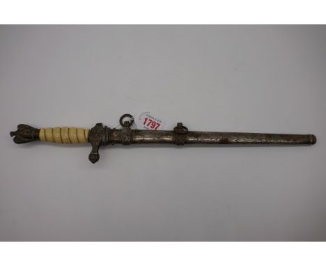 A German Third Reich Kriegsmarine officer's dress dagger and sheath. (a.f) 