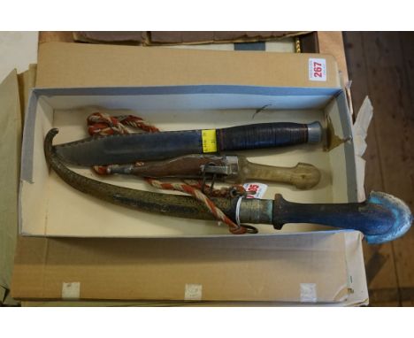 A Bowie knife; together with an Arab dagger and brass sheath; and another smaller horn handled example. (3) 
