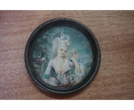European School,&nbsp;late 18th century, bust length portrait miniature of a lady in a garden, on ivory, 9.7cm diameter.&nbsp