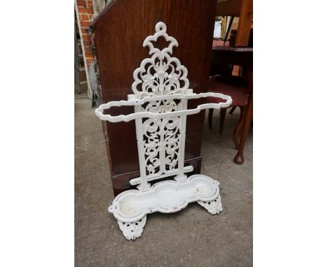 A white painted cast iron stick stand,&nbsp;83cm high.&nbsp; 