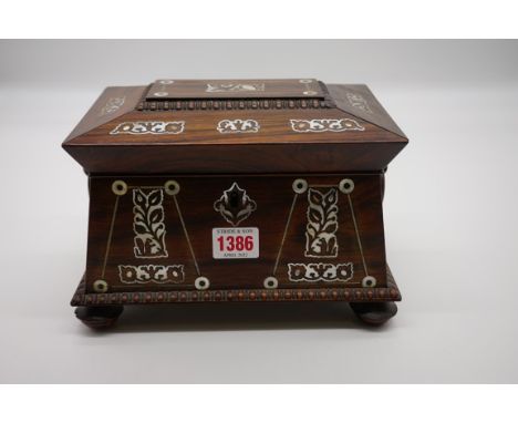 A Victorian rosewood and mother-of-pearl inlaid sarcophagus tea caddy,&nbsp;22.5cm wide.&nbsp; 